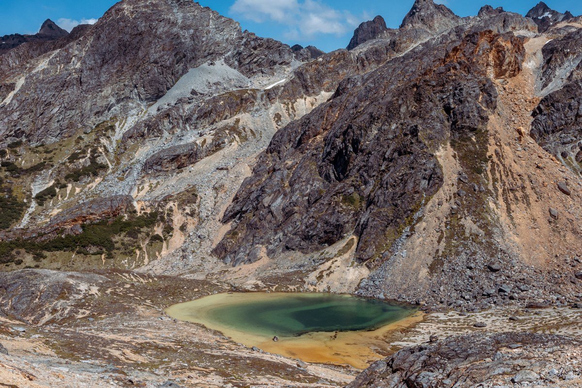Patagonia dramatic granite peaks and turquoise glacial lake wide landscape panorama