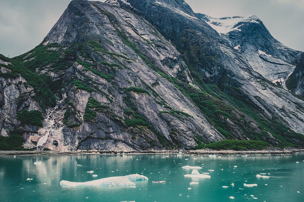 Ventisquero Yelcho Chile turquoise glacial lagoon iceberg kayak reflections temperate rainforest