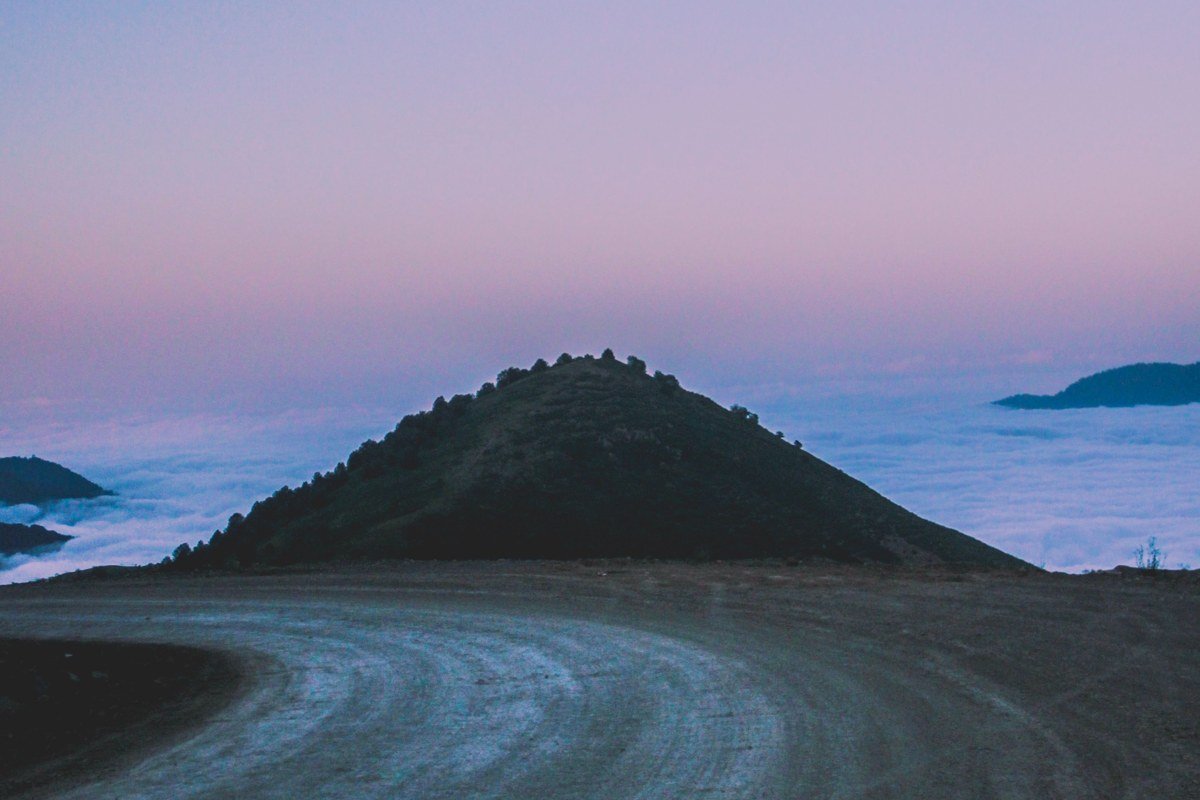Llica Bolivia western salt flat edge remote unpaved road no vehicles dusk low light long exposure