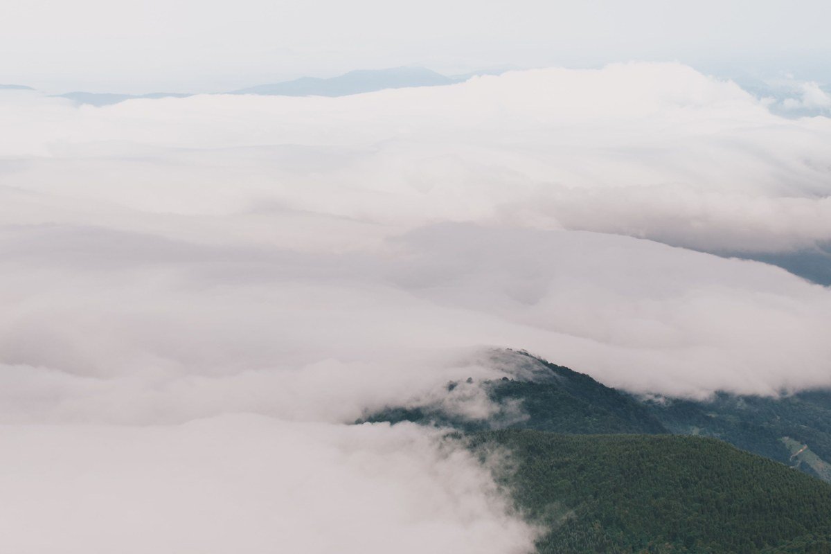 fog-filled valley seen from Brockway Mountain Drive overlook Michigan with Lake Superior in the distance