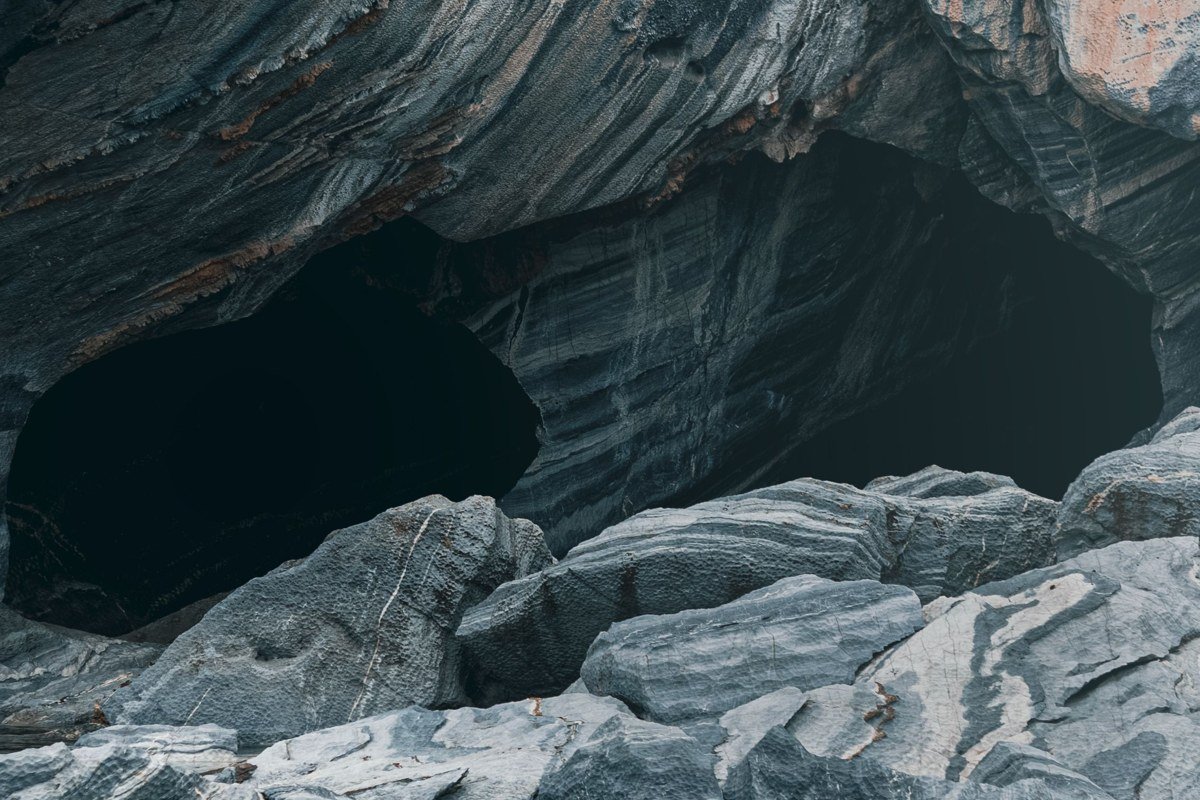 sandstone sea caves at Mawikwe Bay Apostle Islands with kayaks lined up outside the cave mouths
