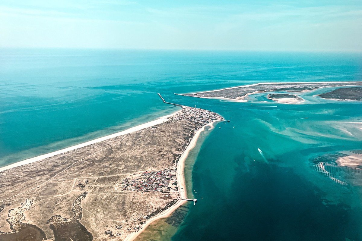 aerial view of a US barrier island coastline with bridge and turquoise water