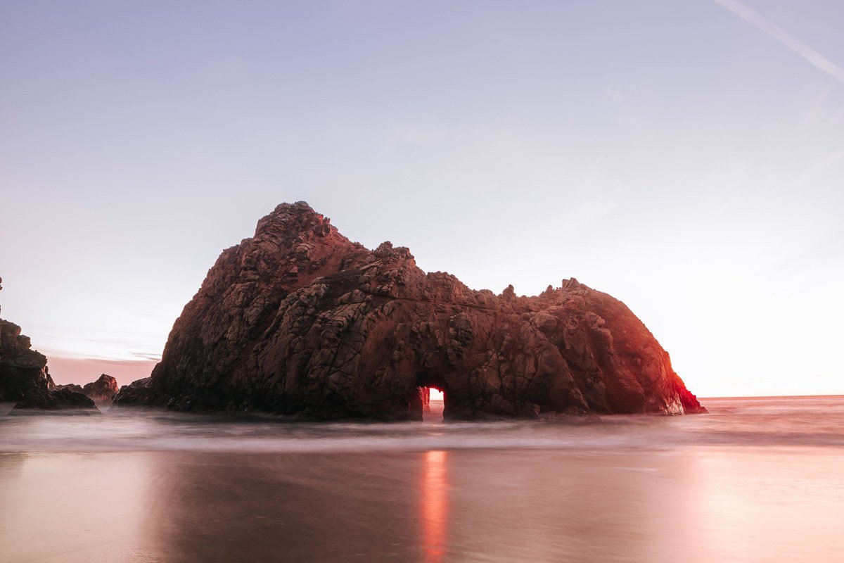 Pfeiffer Beach, Big Sur, California, purple sand and Keyhole Rock at sunset. Photo credit: placeholder, replace before publish