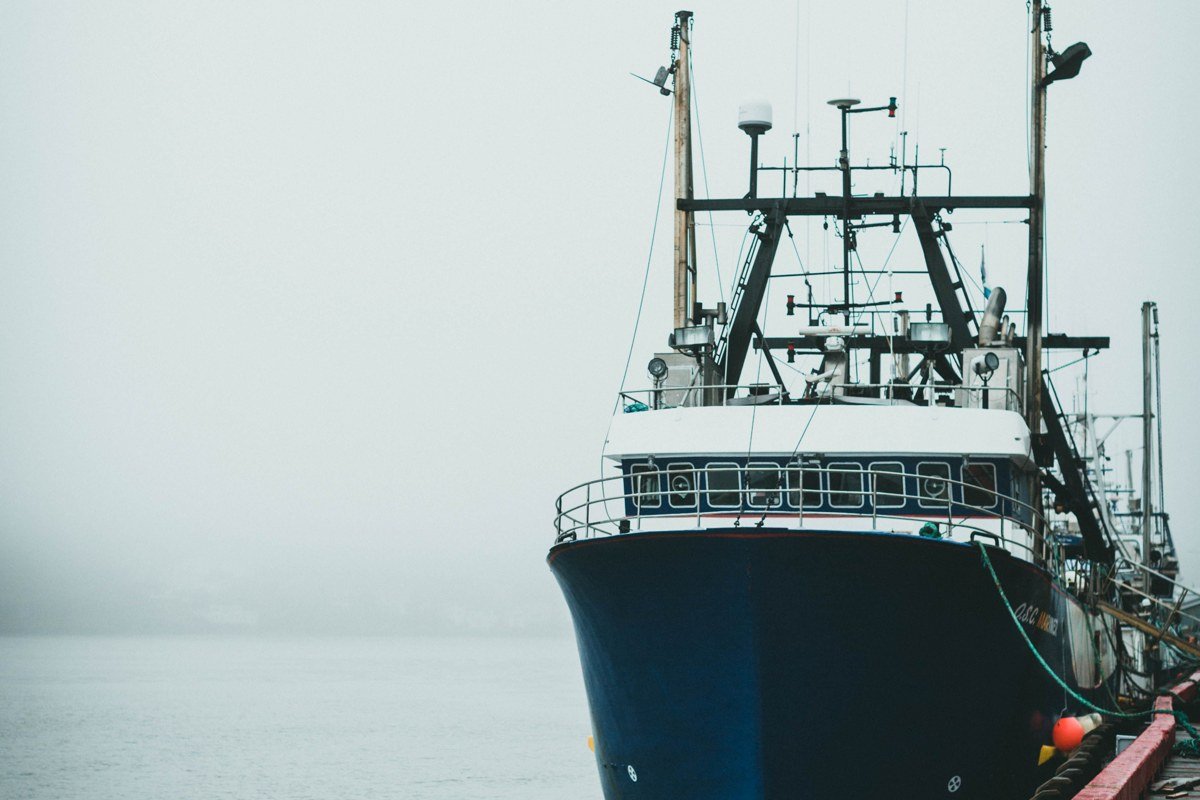 Stonington Maine lobster boats and granite piers shrouded in fog