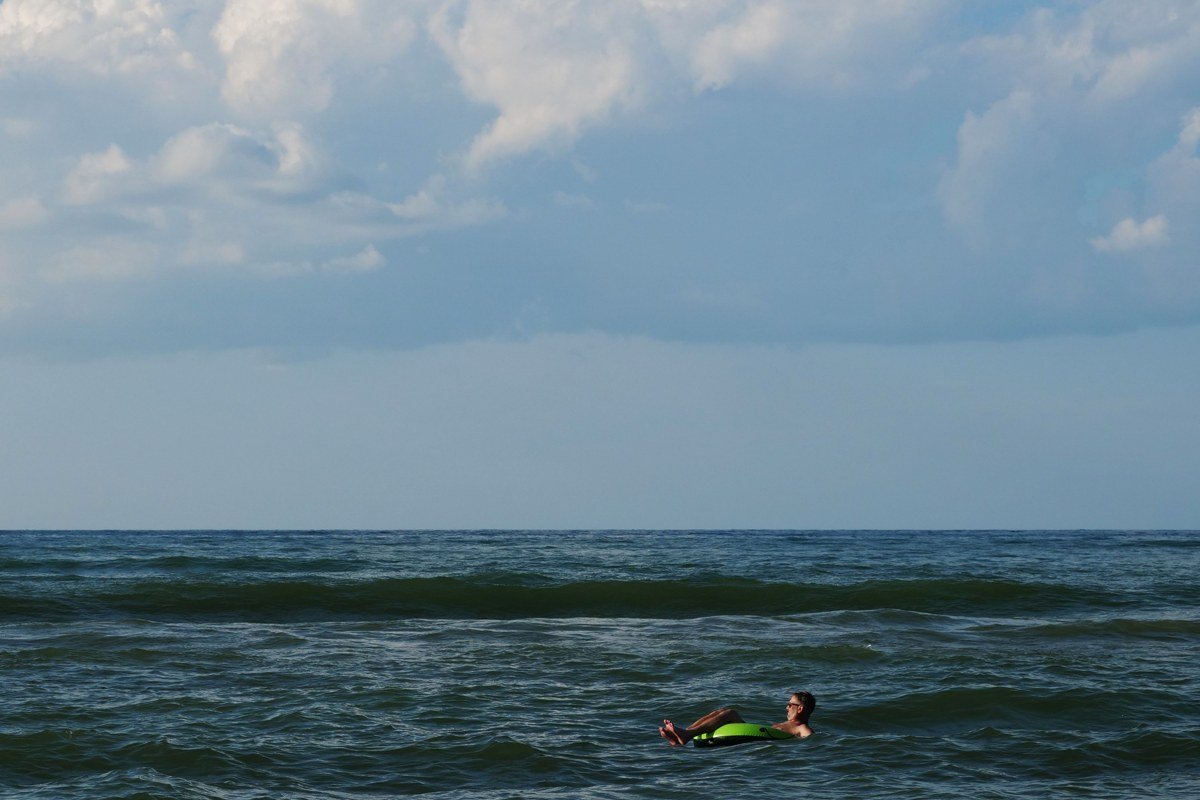 New Buffalo Michigan public beach at sunset with Lake Michigan waves