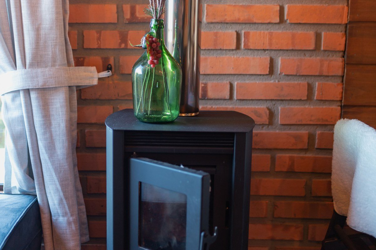 cozy cabin living room with roaring wood fireplace and mountain view window, Pigeon Forge Tennessee