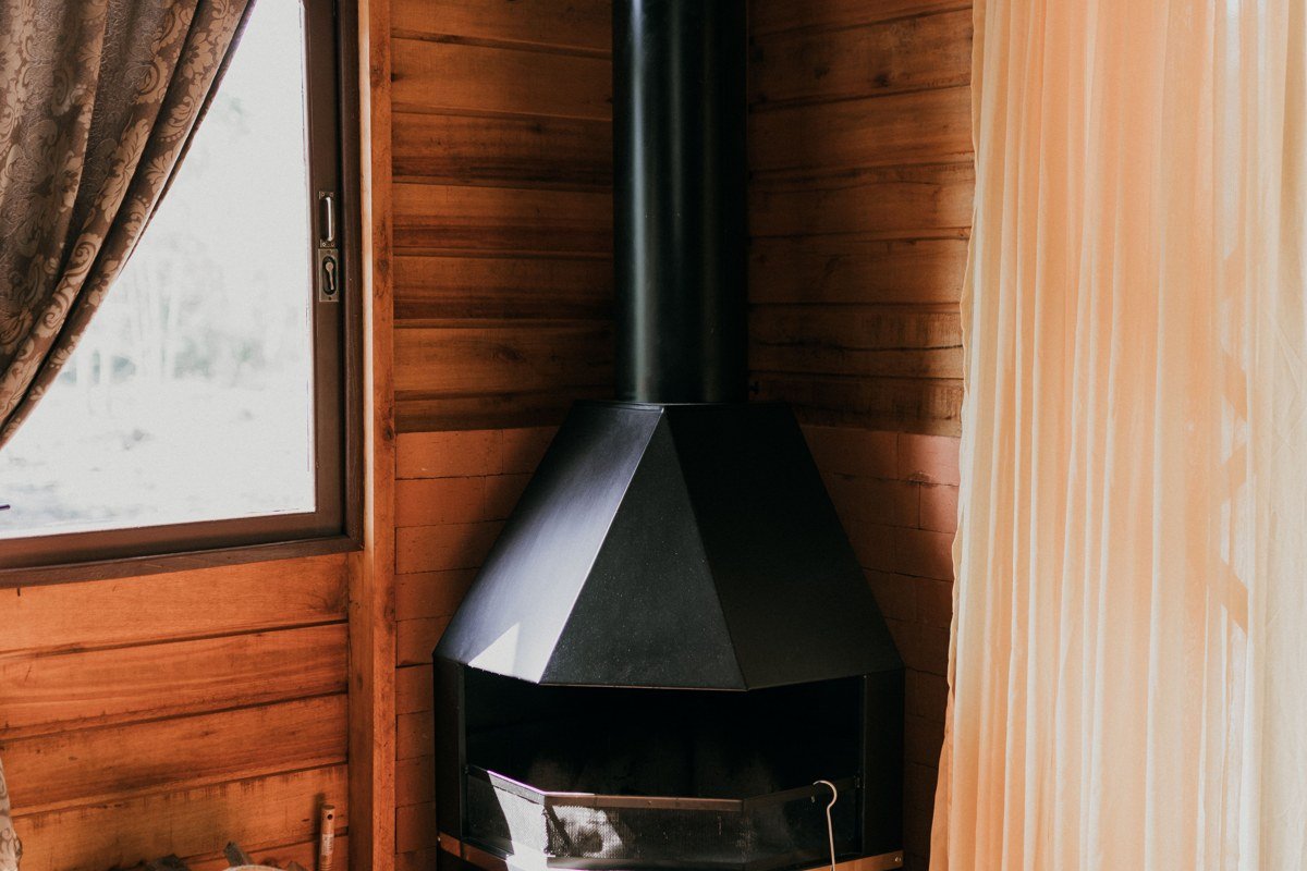 log cabin with wood fireplace and rocking chairs on porch overlooking Great Smoky Mountains, Bryson City North Carolina