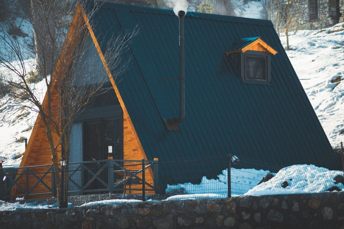rustic secluded cabin with smoking chimney in fall forest, Cosby Tennessee Smoky Mountains