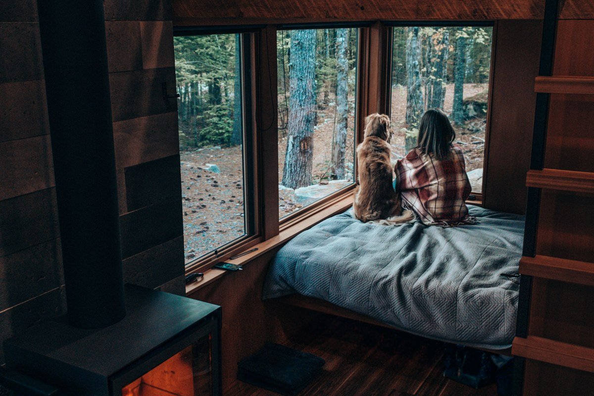 cabin fireplace with wood stove and plaid blanket, Cherokee North Carolina autumn cabin interior