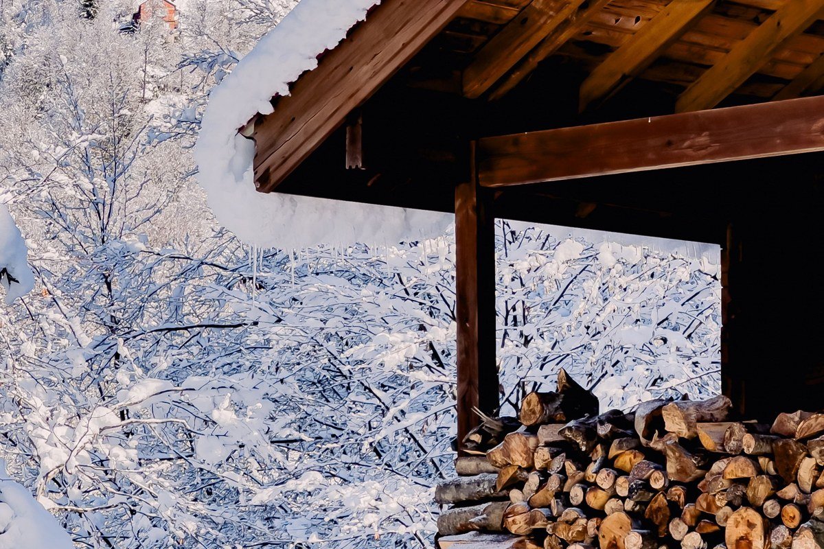 mountain cabin porch with fireplace visible through window, Maggie Valley North Carolina autumn