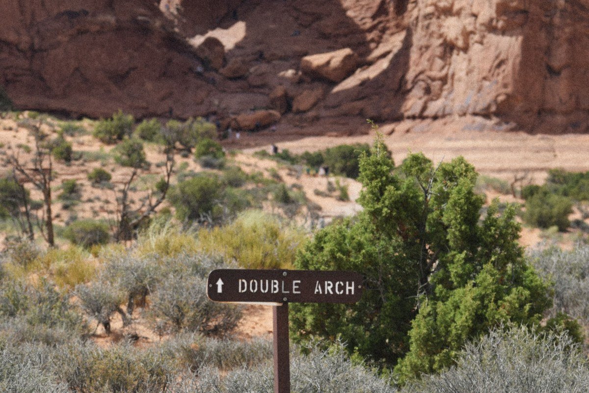 Double Arch massive sandstone arches meeting at sunrise, Arches National Park
