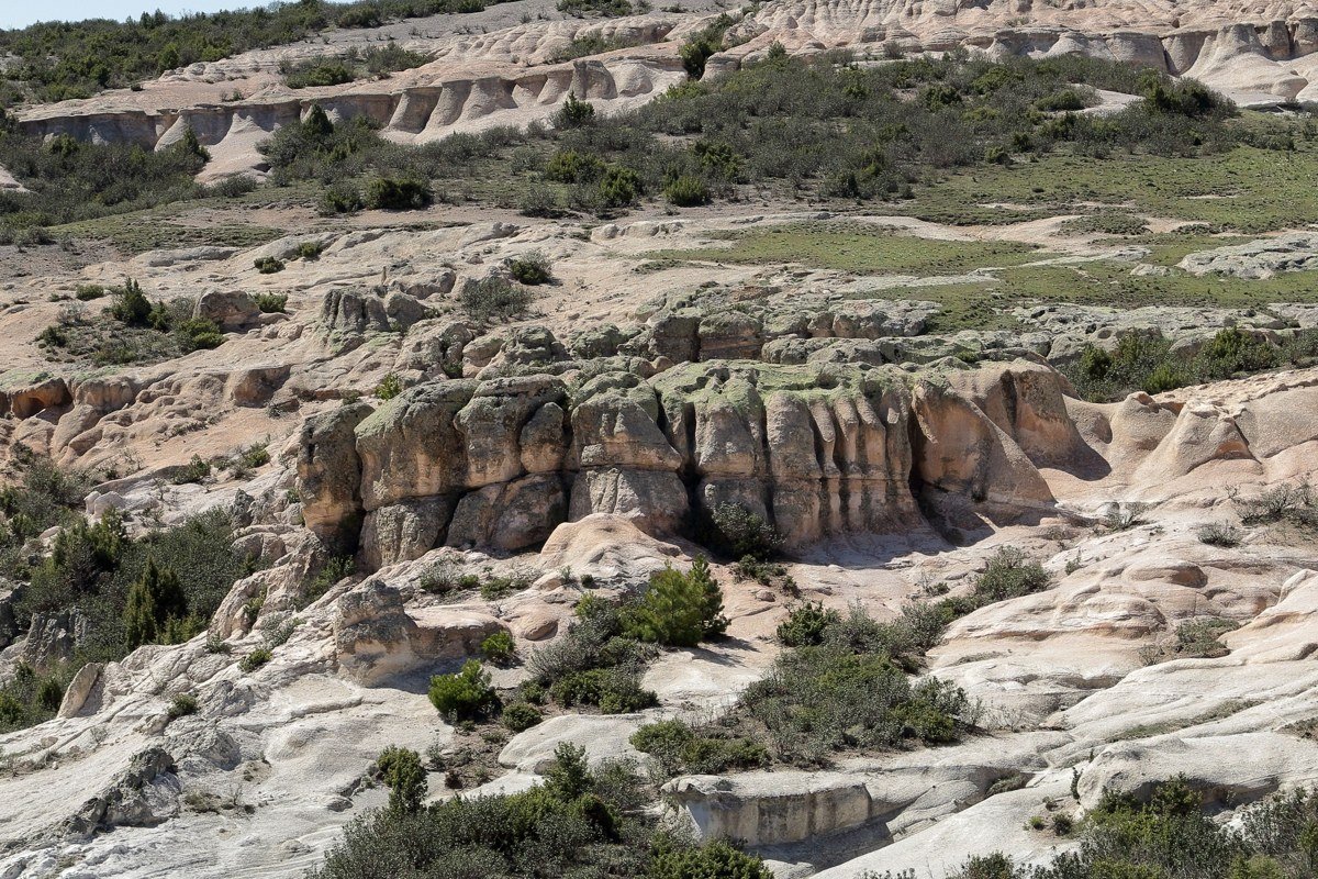 Conata Basin Overlook Badlands South Dakota wide grassland and eroded buttes at dusk