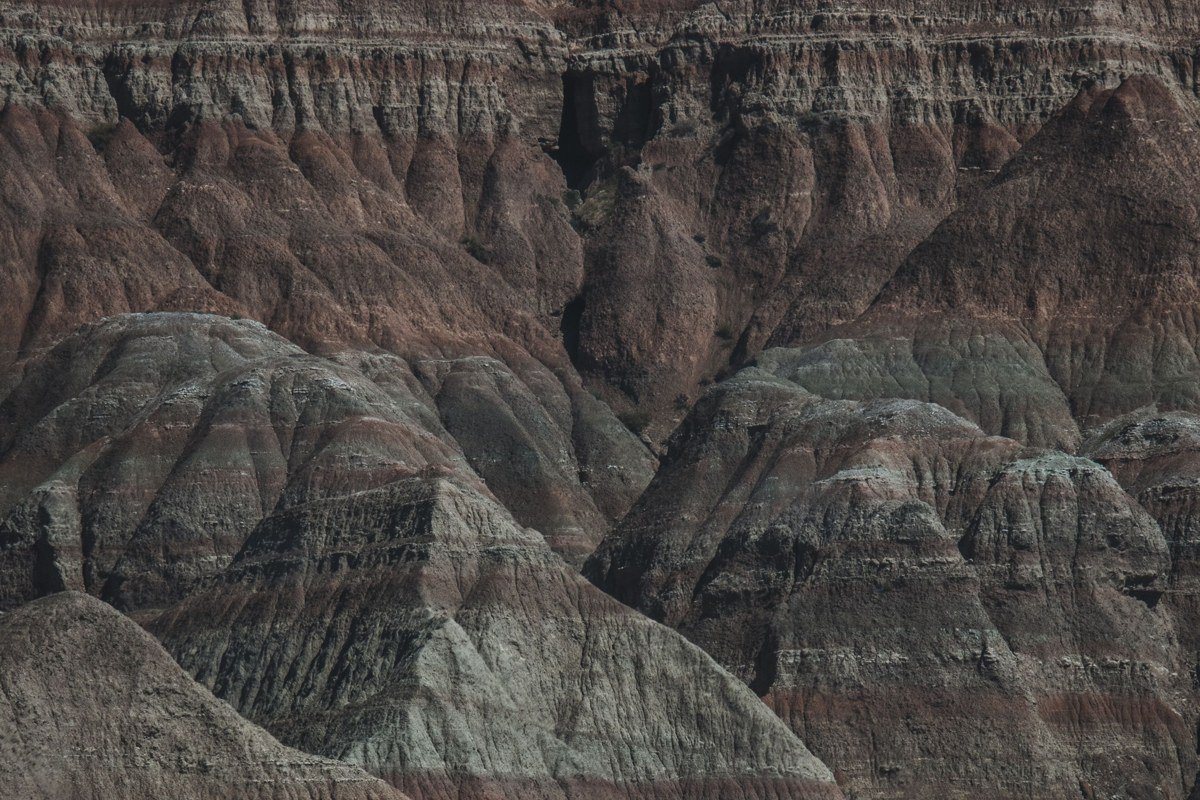 Yellow Mounds Overlook Badlands South Dakota golden mudstone hills under twilight sky