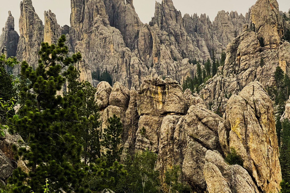 Pinnacles Overlook Badlands South Dakota jagged rock spires silhouetted against starry sky