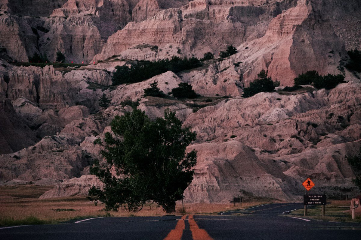 Pinnacles Overlook Badlands South Dakota wide canyon view at dawn with layered rock spires