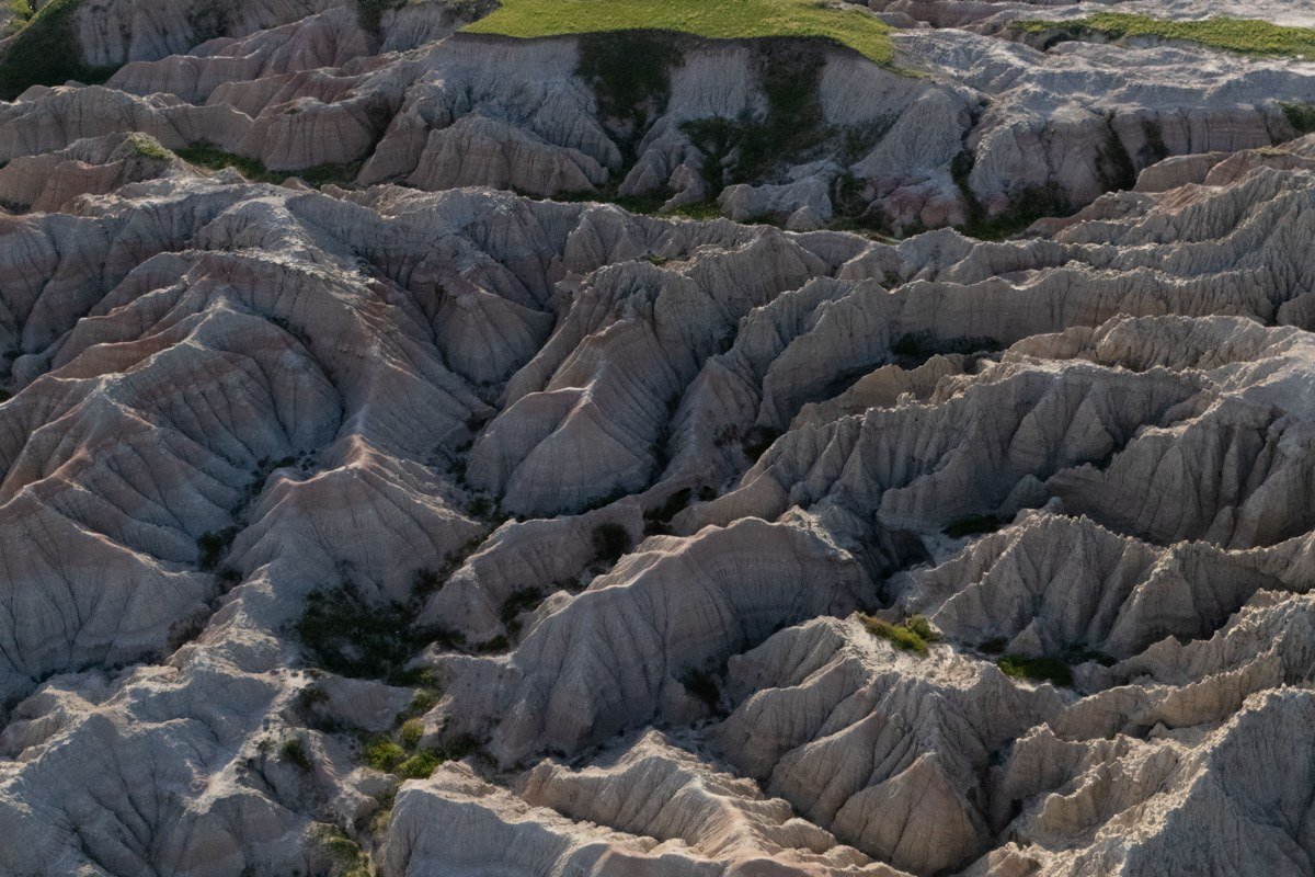 Window Trail Badlands South Dakota natural rock frame overlooking canyon at golden hour