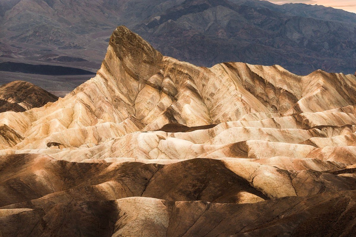 Badlands National Park South Dakota jagged striped rock formations at sunrise