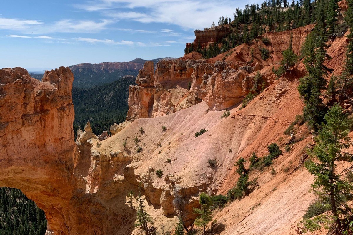 Natural Bridge Bryce Canyon red rock arch formation in midday sun