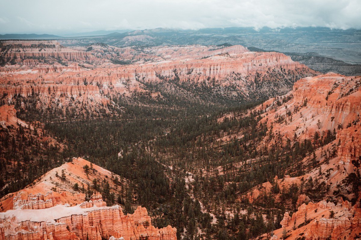 Natural Bridge overlook Bryce Canyon snow arch red rock winter