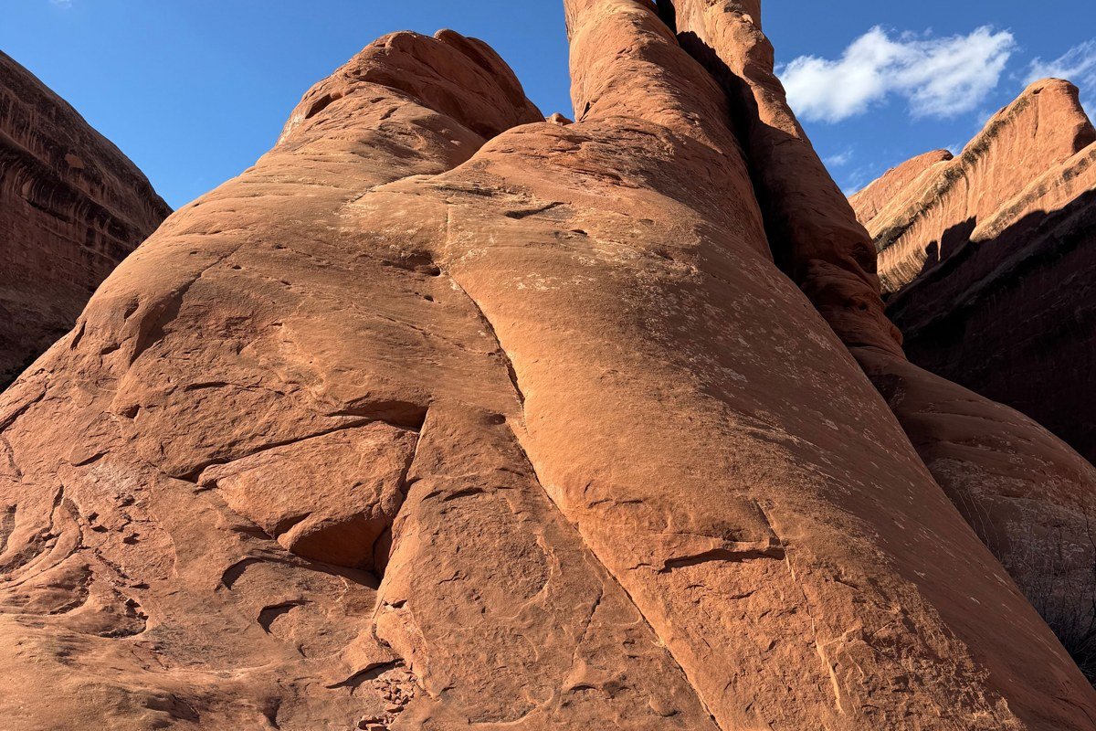 Grosvenor Arch Utah double sandstone arch rising from desert scrubland