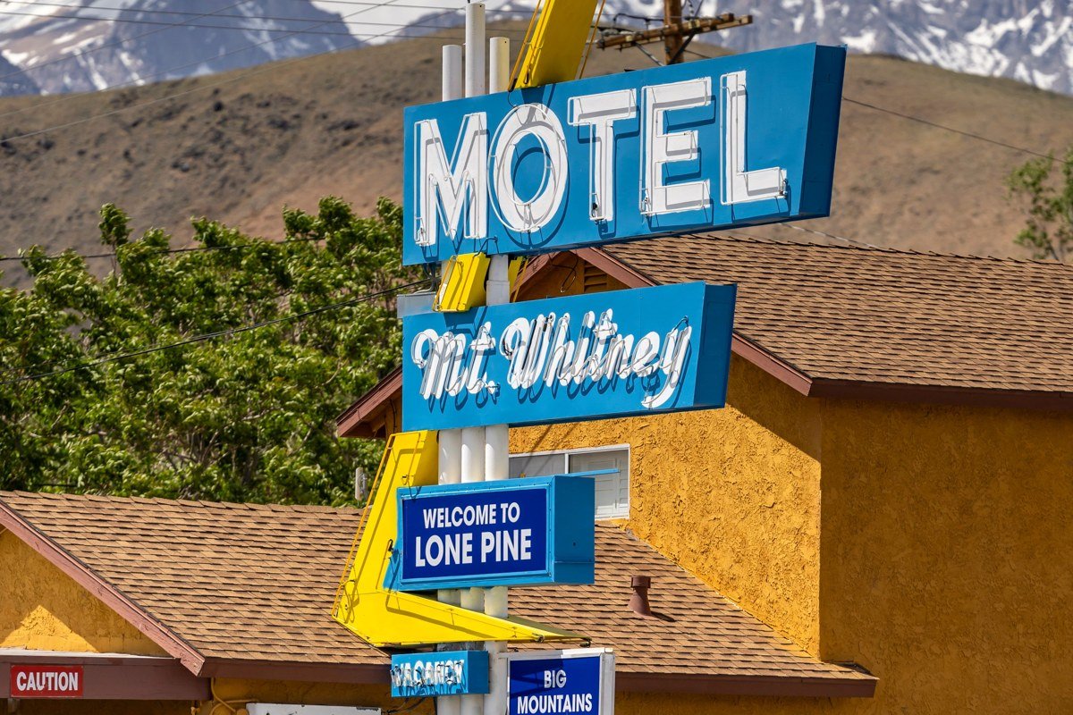 Kanab Utah main street with red rock cliffs backdrop and vintage motel signs