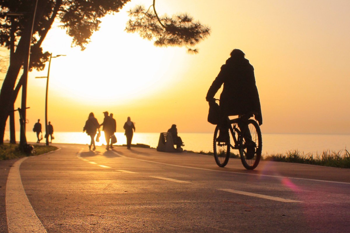 Falmouth Massachusetts Shining Sea Bikeway along the coast with cyclists and ocean view