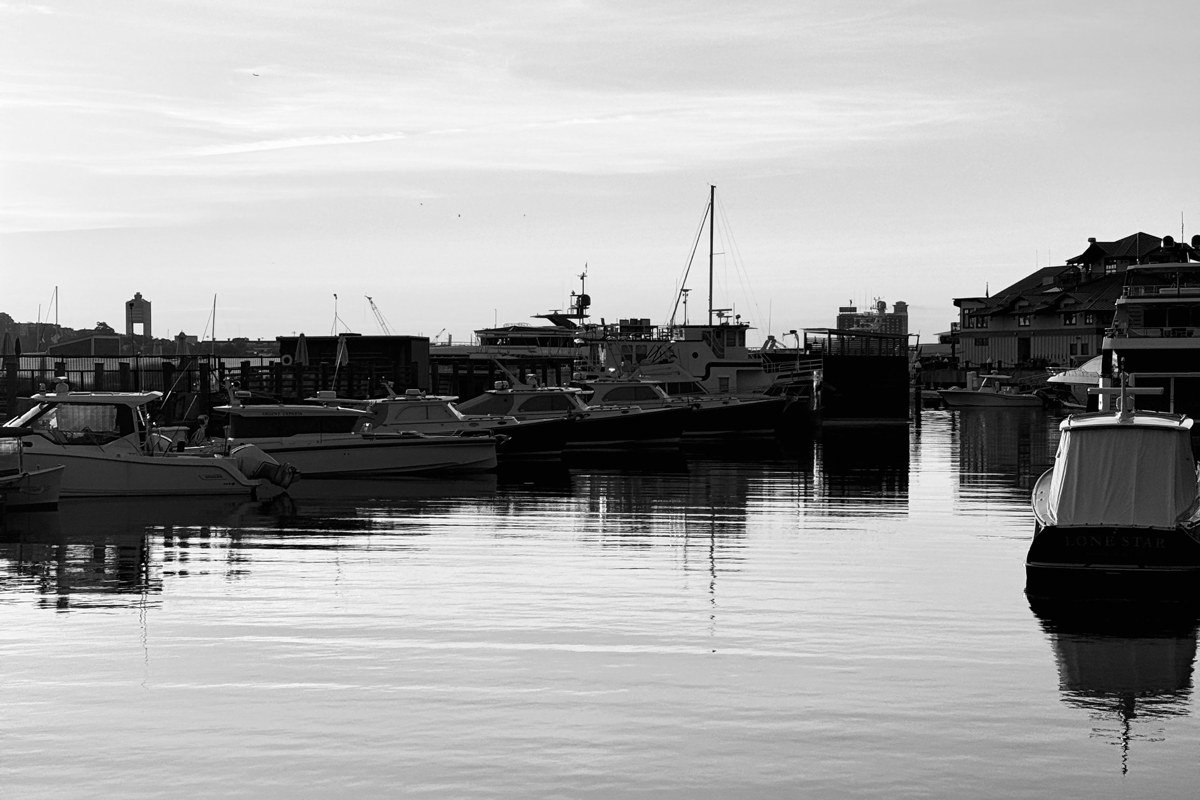 Woods Hole Massachusetts harbor with ferry boat and drawbridge at sunset