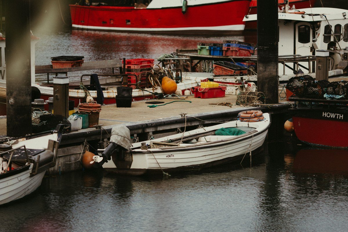 Provincetown Massachusetts harbor with fishing boats and Pilgrim Monument