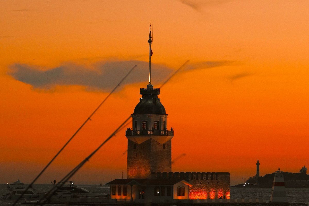 Provincetown harbor at sunset with the Pilgrim Monument and fishing boats