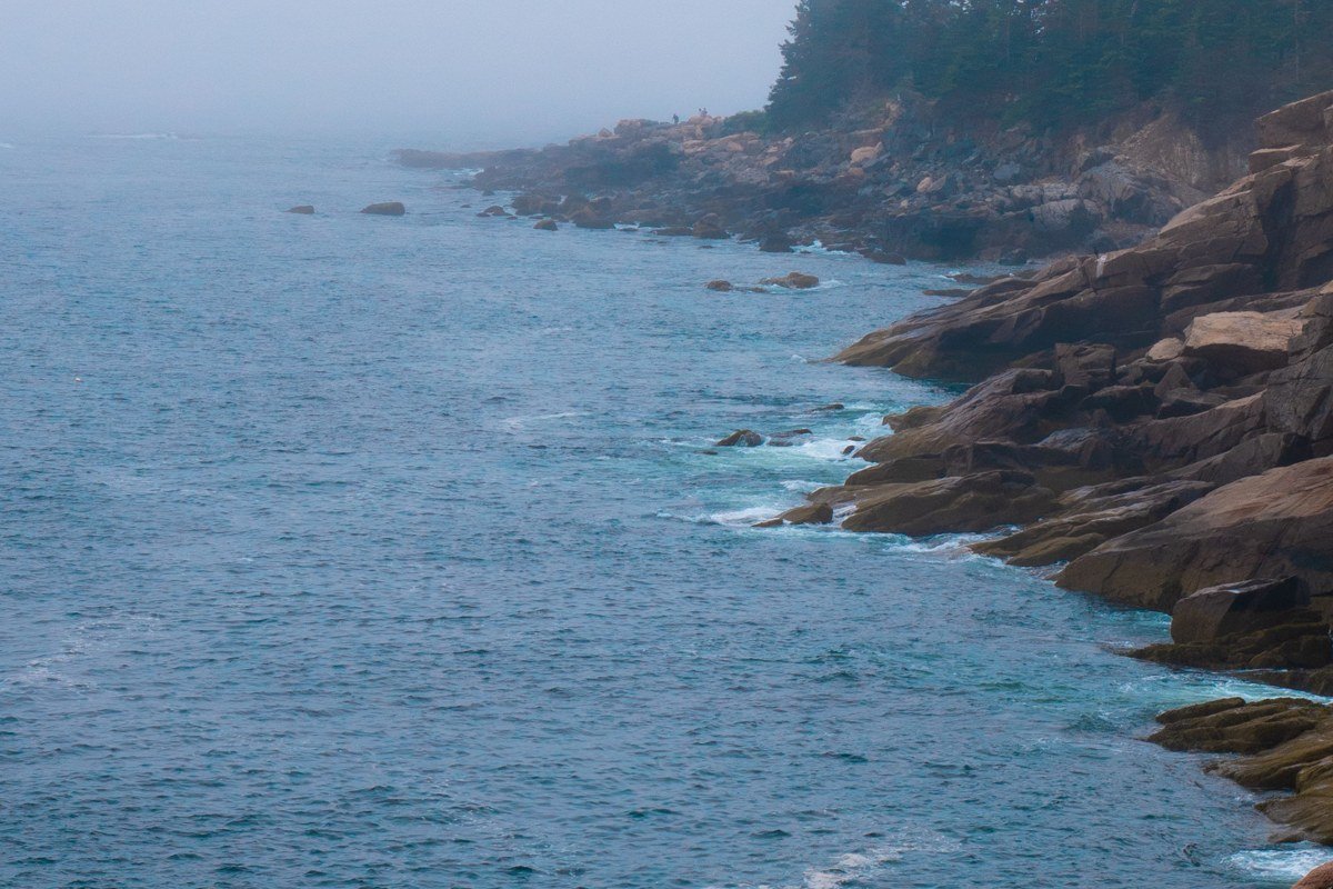 West Quoddy Head Light Lubec Maine red and white candy-striped tower fog cliffs