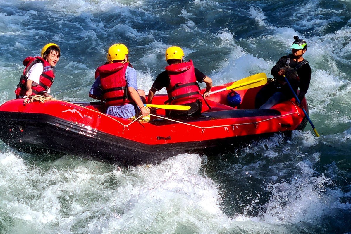 raft crew paddling hard through one of the back-to-back rapids in the Numbers, no flat water in sight