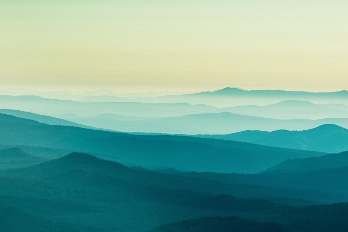 Foothills Parkway overlook Tennessee with layered ridgelines rising above a solid white fog sea at dawn