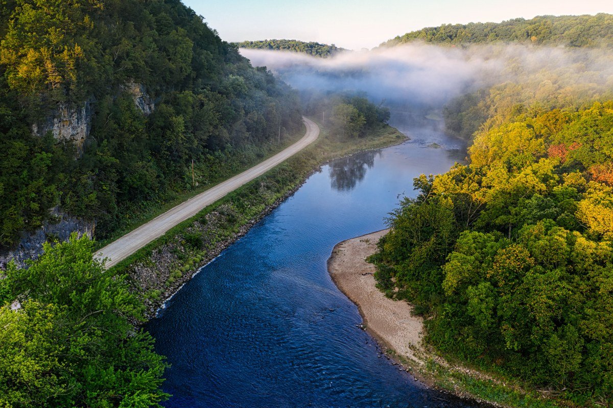 Little River Road Tennessee mist rising off waterfall and river bend at early morning light