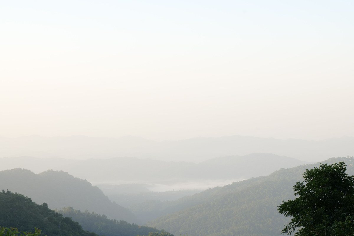 Gatlinburg Tennessee mountain overlook with morning fog and distillery porch in foreground