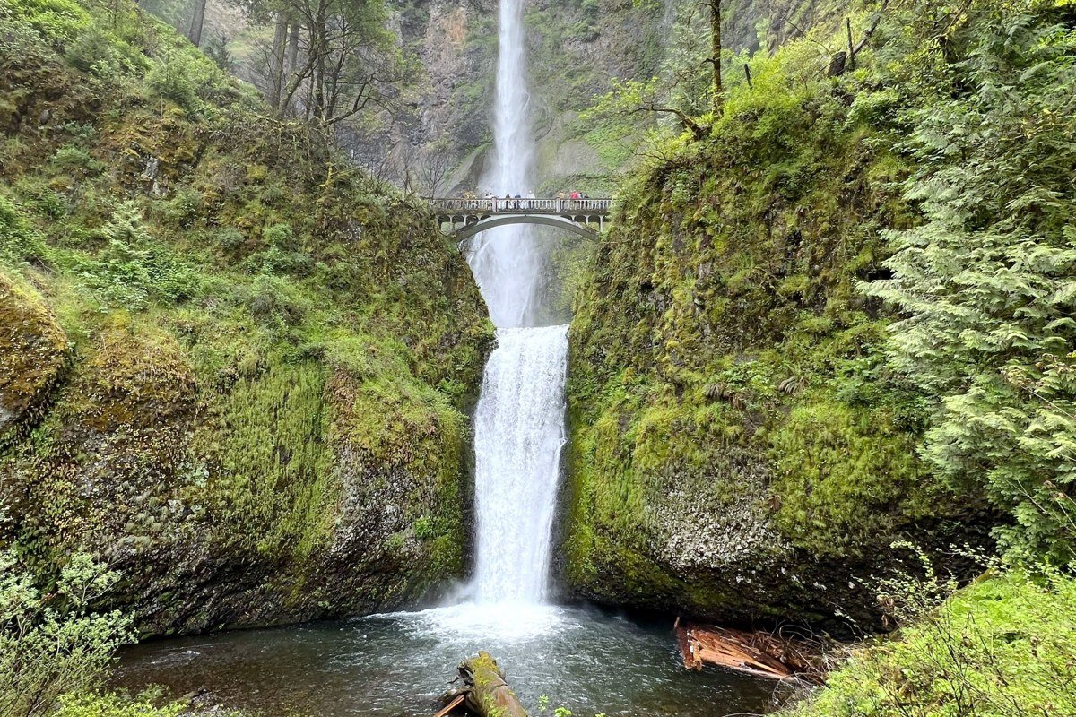 South Falls at Silver Falls State Park Oregon with waterfall mist blending into forest fog
