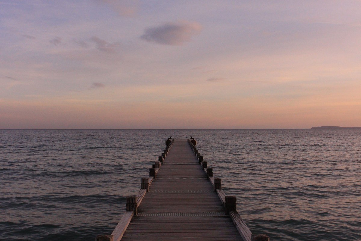 Lake Luzerne New York small beach with wooden dock at sunset