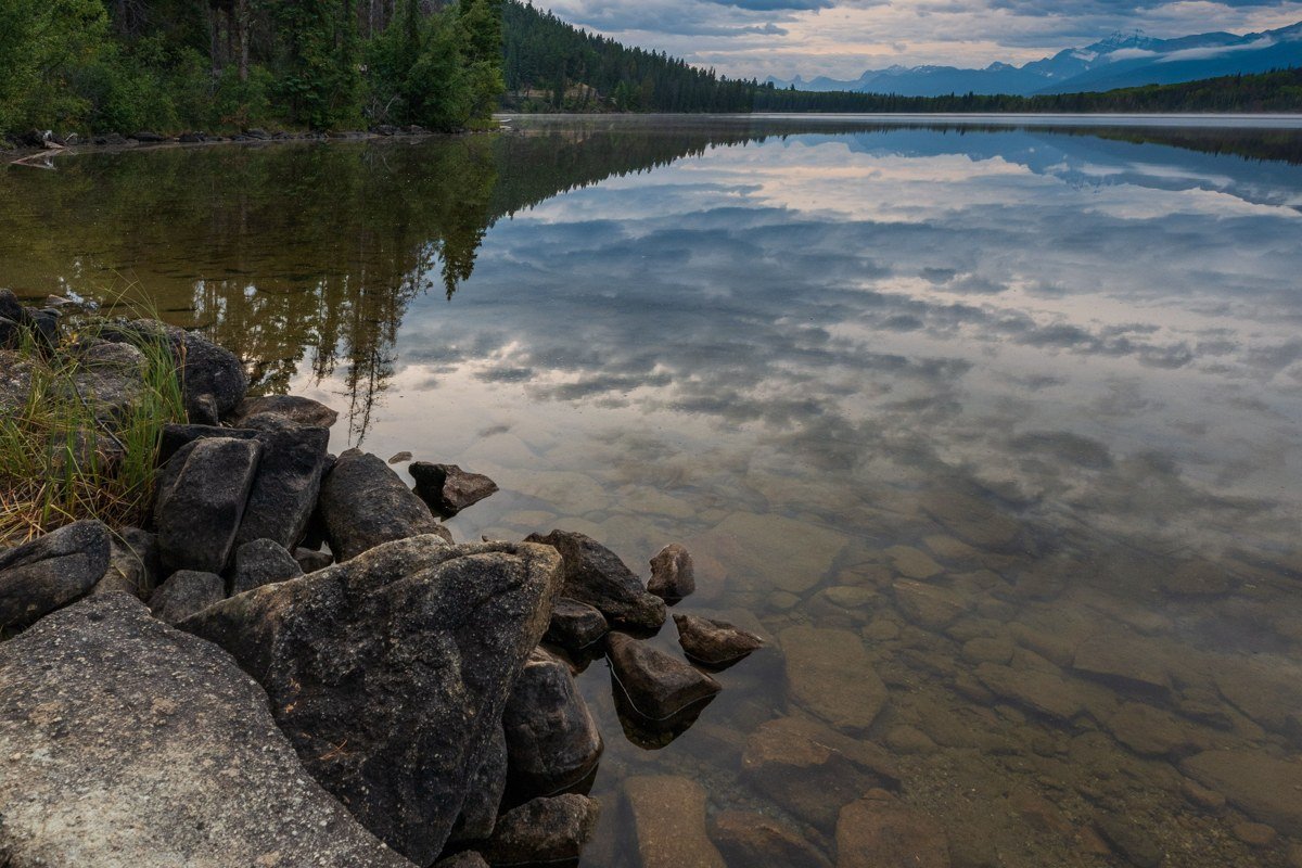 Piseco Lake New York clear water rocky shoreline pine trees