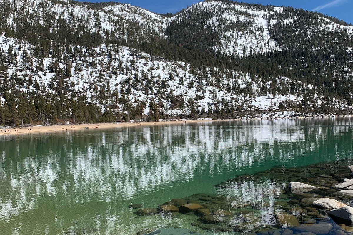 split scenic view of Lake Tahoe blue water and Adirondack pine forest lake, side by side comparison