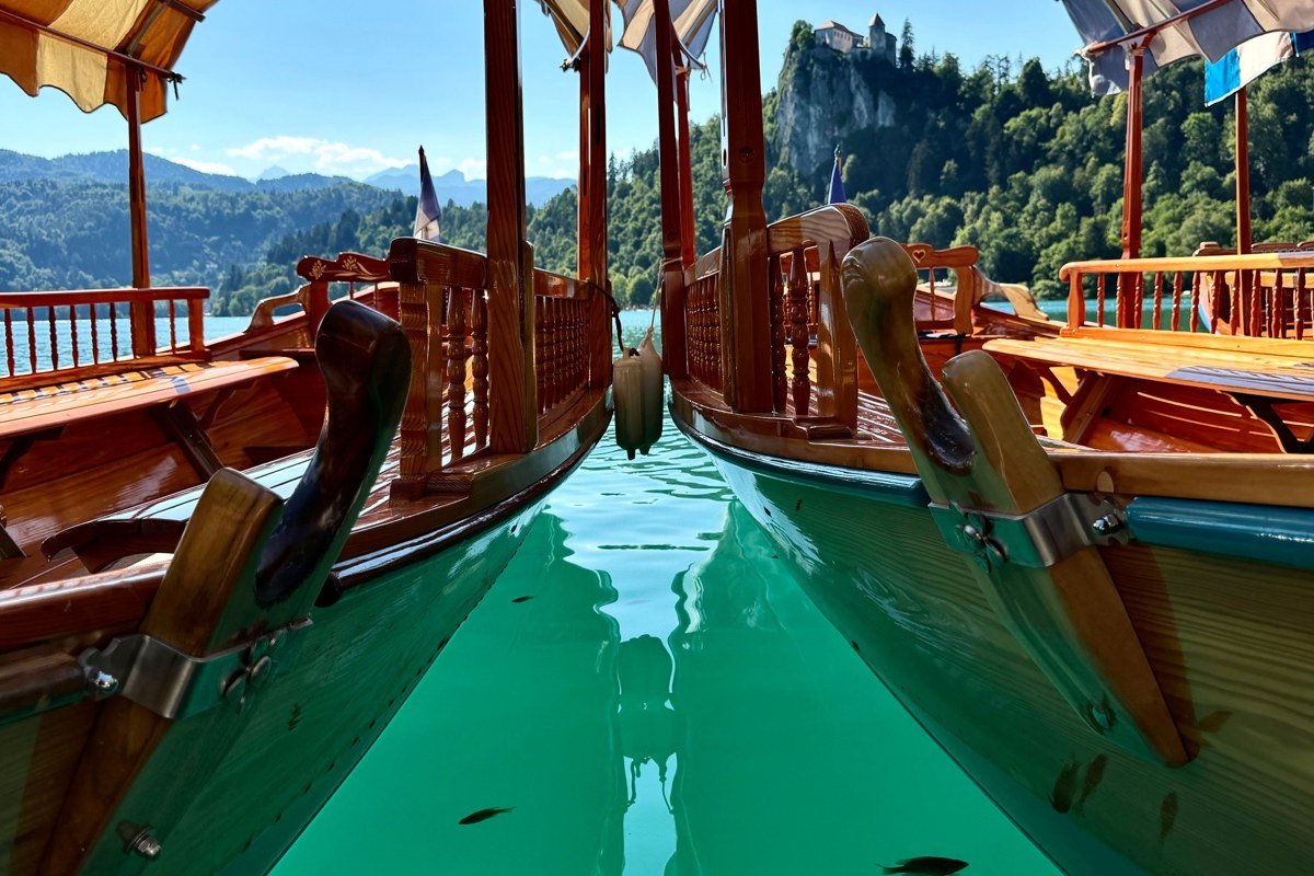 Blue Mountain Lake with historic wooden boats and forested shoreline in the Adirondacks