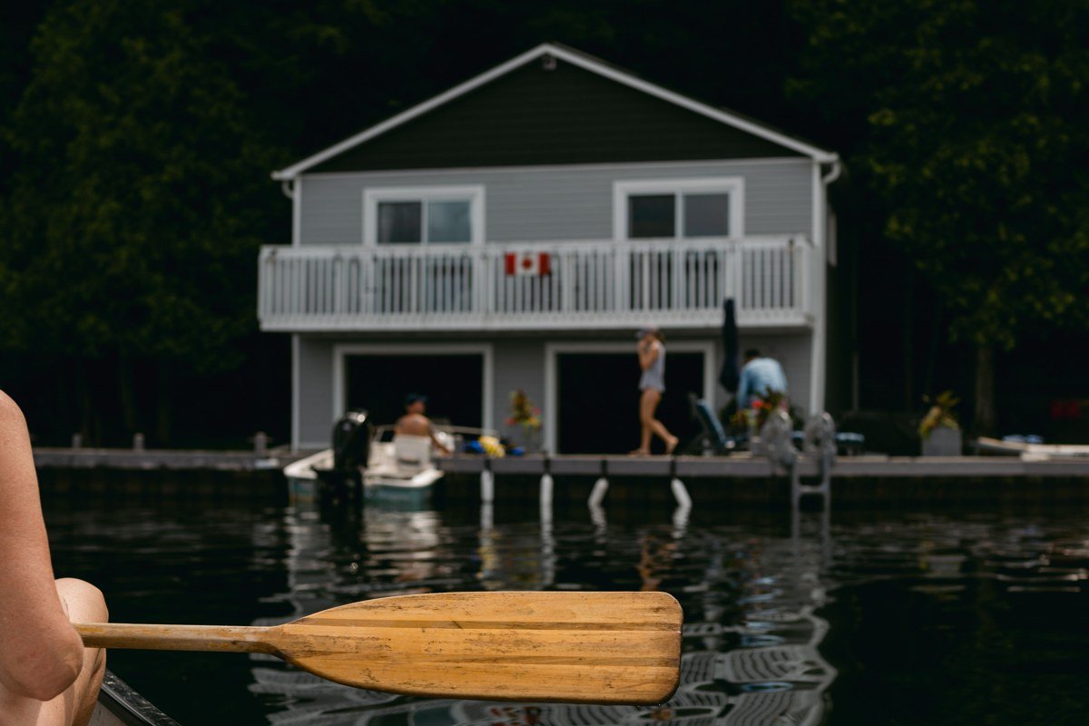 Old Forge New York Fulton Chain of Lakes with canoe launch and Adirondack forest shoreline