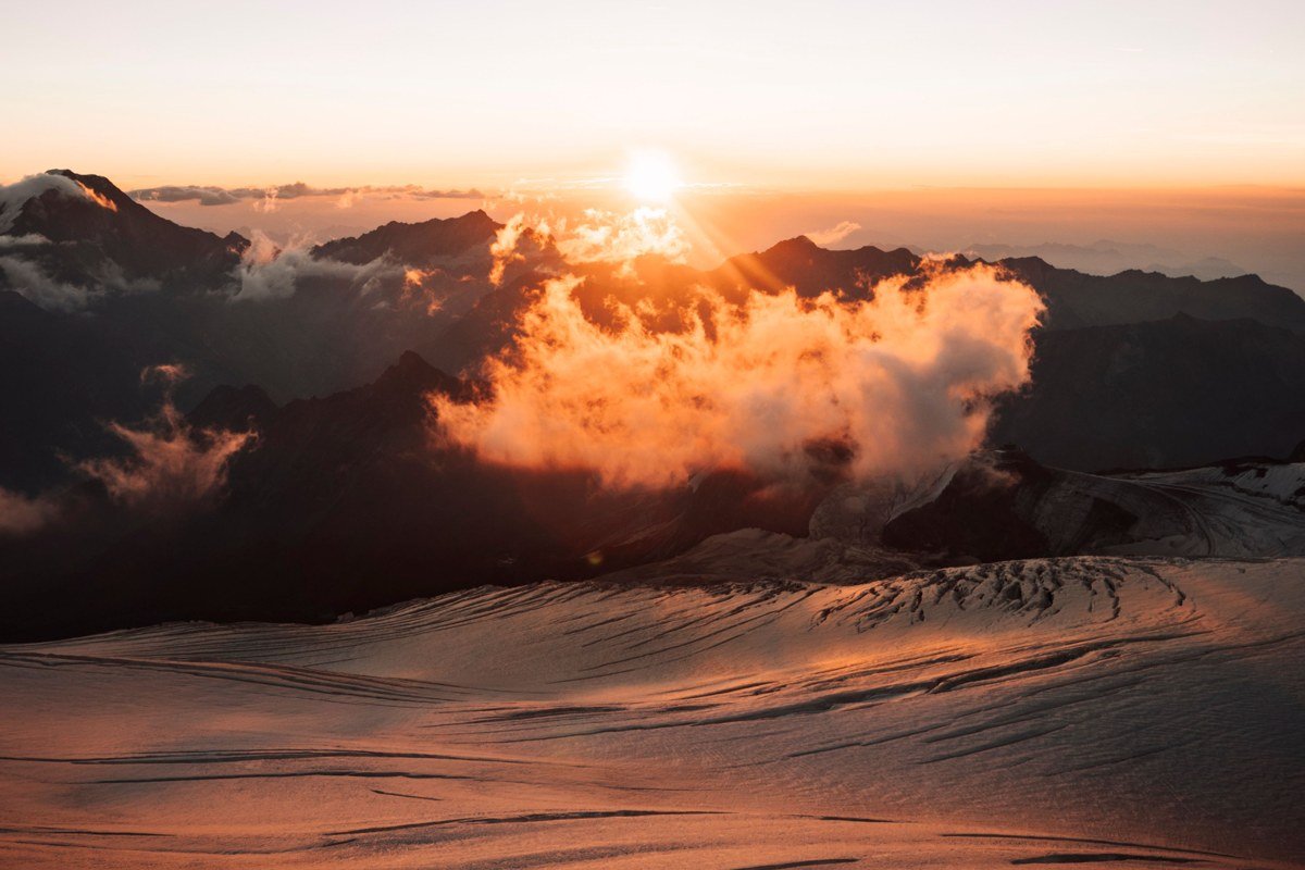 Sunrise Mount Rainier visitor center clouds filling valley below at golden hour