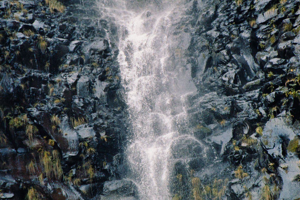 Comet Falls Mount Rainier waterfall shrouded in fog and spray