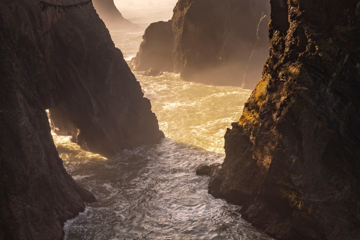 Sea Lion Caves Oregon coastline cliffs with fog over the Pacific below Highway 101