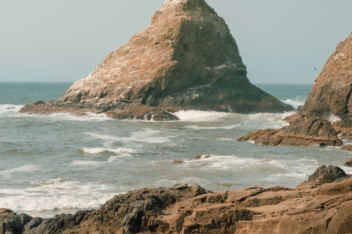 Samuel H Boardman State Scenic Corridor Oregon coastline cliffs fog over Natural Bridges