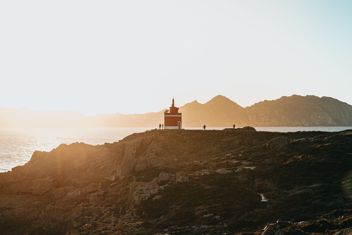 Cattle Point lighthouse on San Juan Island at golden hour with driftwood beach