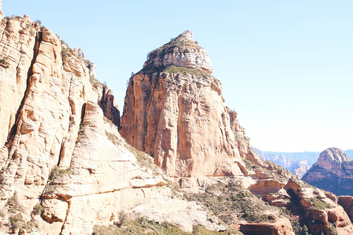Chapel of the Holy Cross built into red rock cliff at sunrise Sedona Arizona