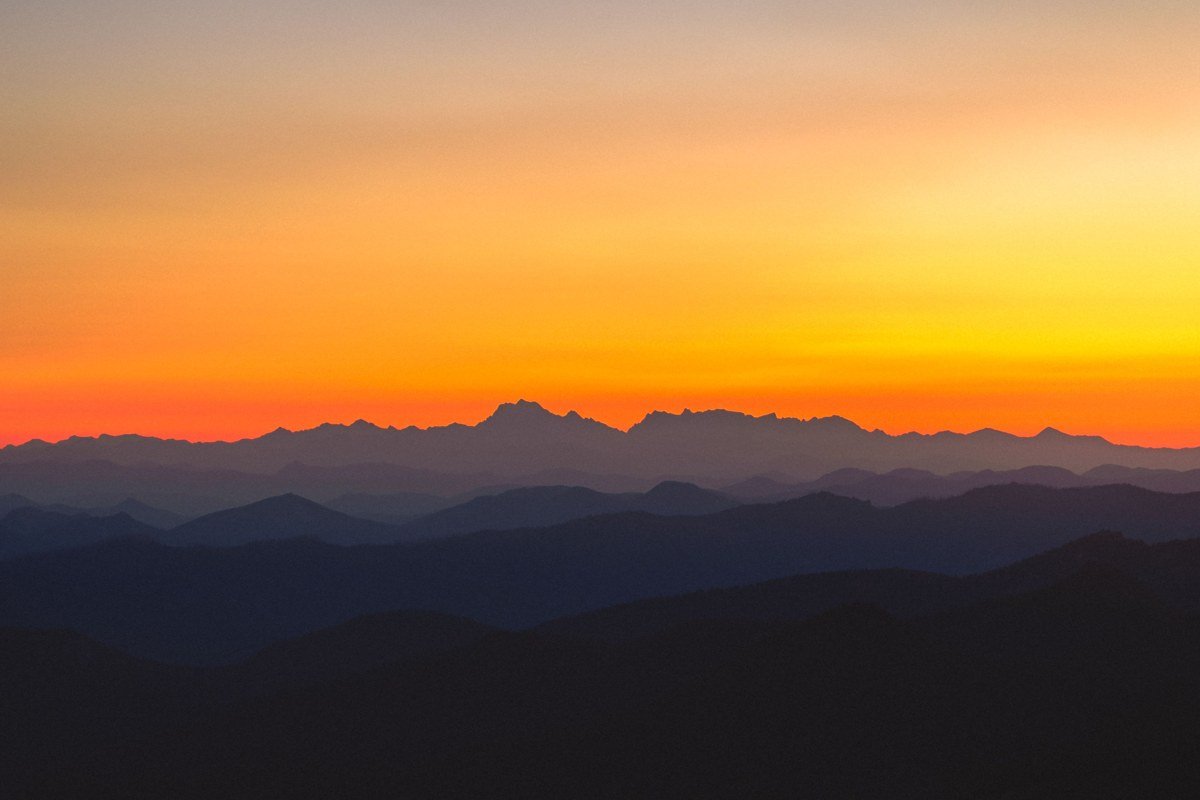 Clingmans Dome observation tower North Carolina sunrise above sea of clouds and fog-filled valleys