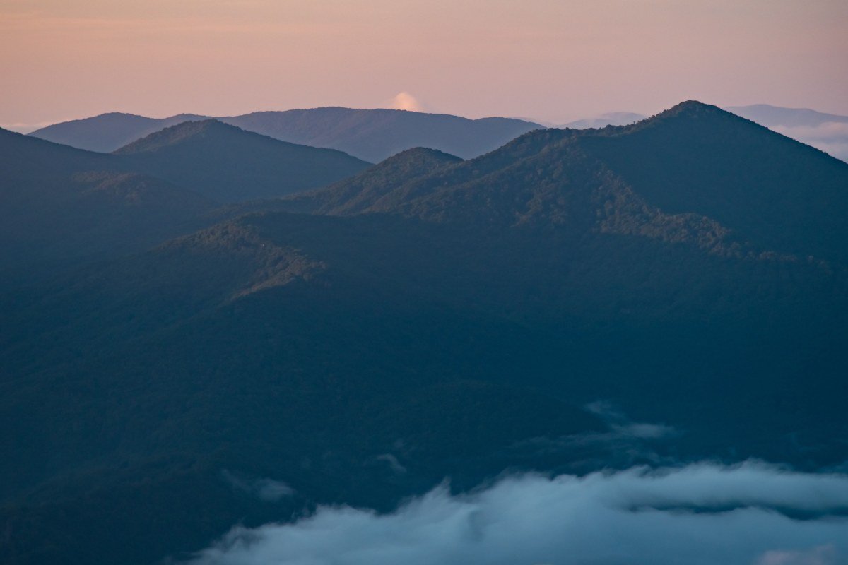 Foothills Parkway Missing Link bridge Tennessee winter sunrise view with fog pooling in Walland valley
