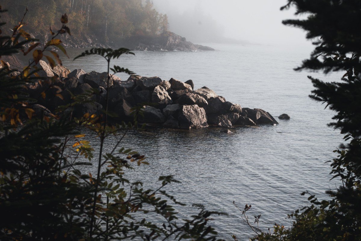Au Sable Light Station Michigan surrounded by fog in Pictured Rocks National Lakeshore forest