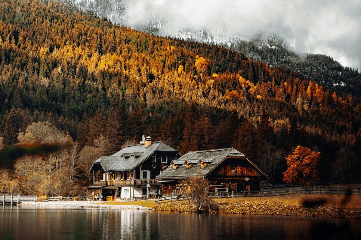 Harveys Lake Vermont autumn cabins with colorful hillside reflection